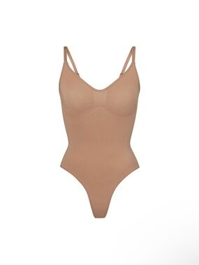 SKIMS Stretch Seamless Thong Bodysuit in Sienna